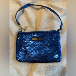 Michael Kors sapphire blue sequined wristlet with gold colored hardware.